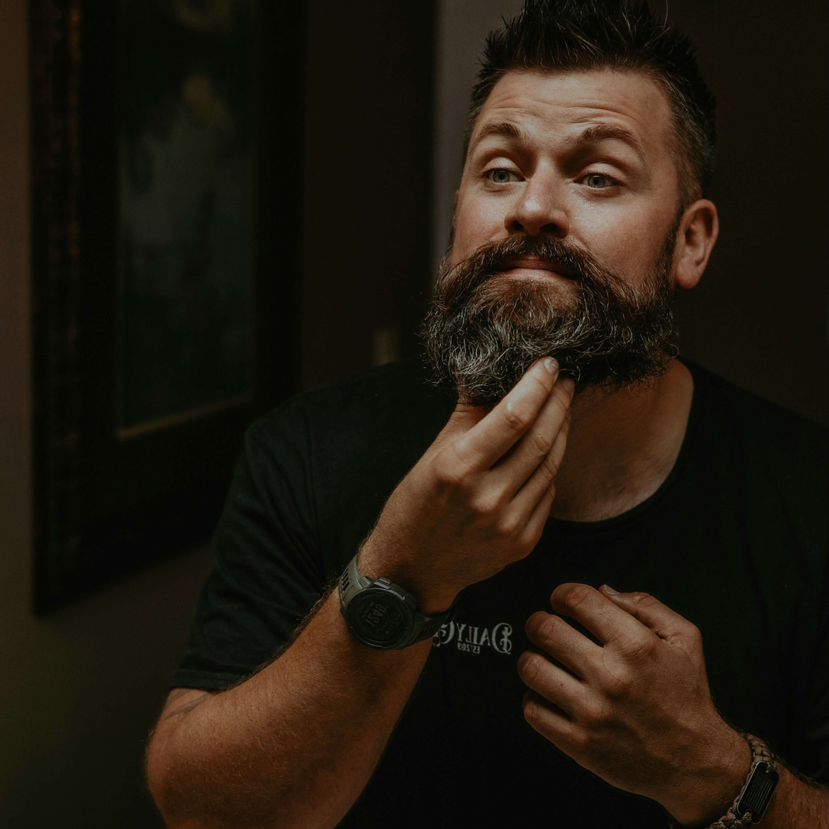 Man styling his beard