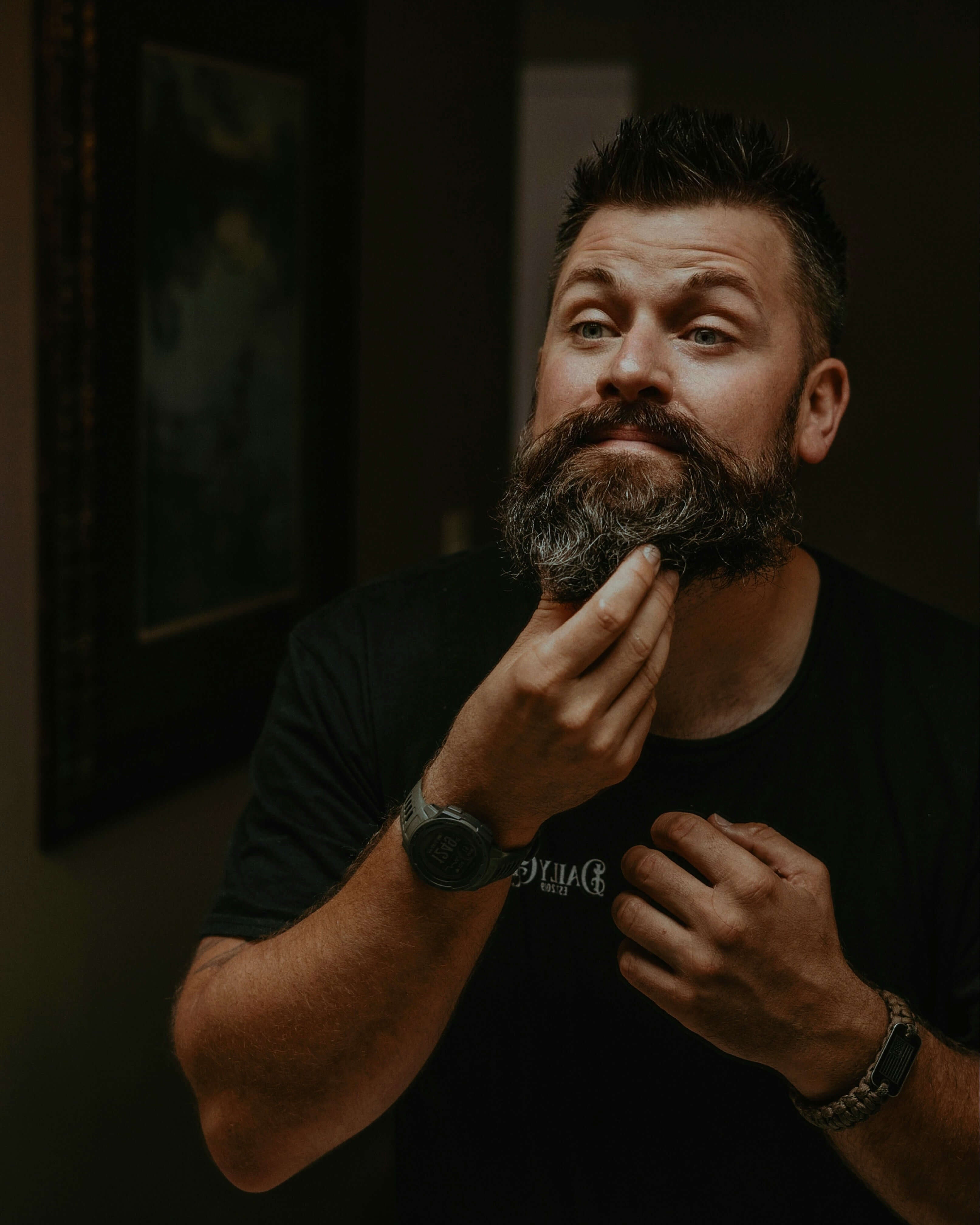 Man styling his beard