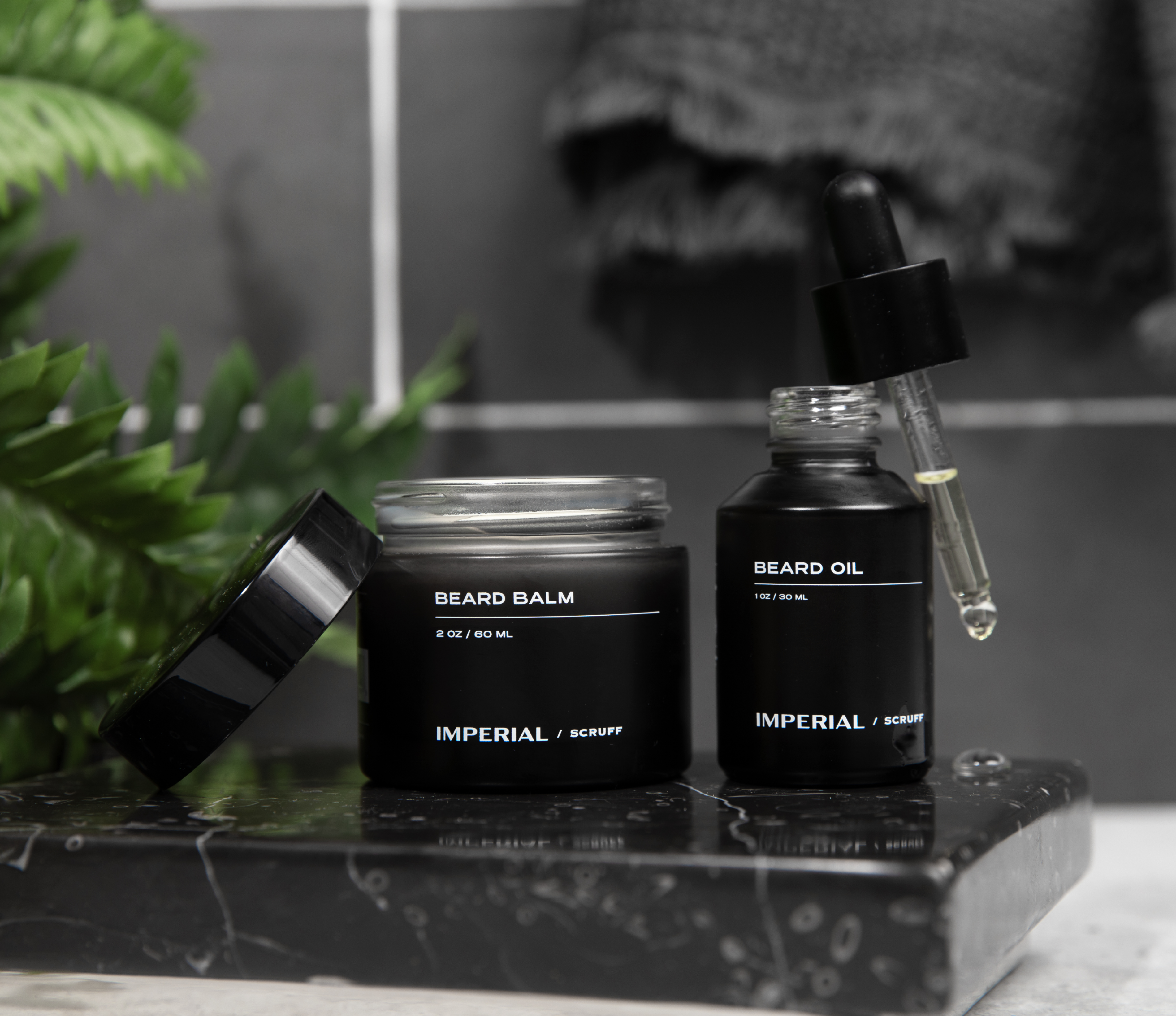 Beard Bundle featuring nourishing Beard Oil and Beard Balm on a marble surface for ultimate grooming.