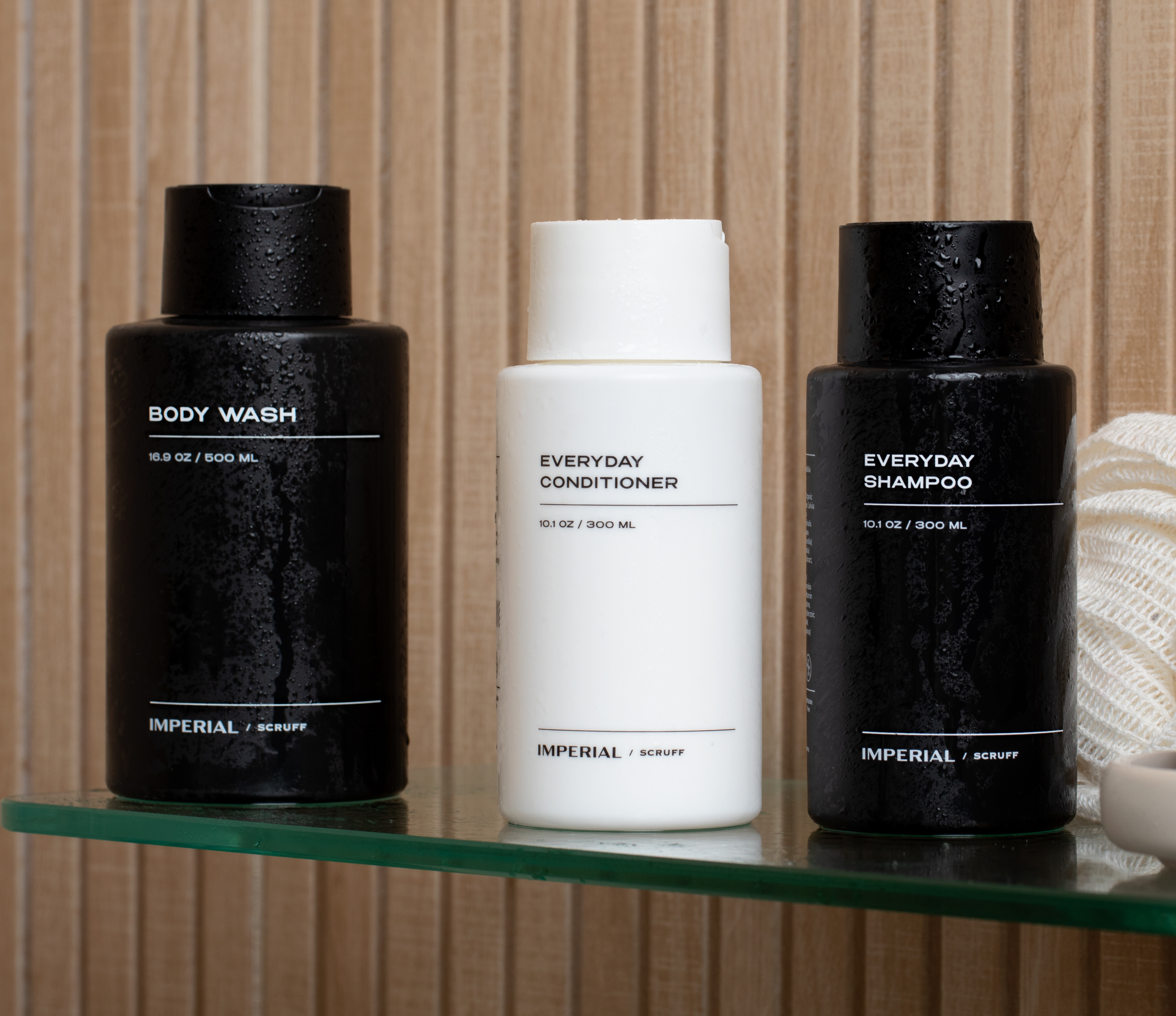 Hair and Body Bundle featuring Body Wash, Everyday Conditioner, and Everyday Shampoo on bathroom shelf.